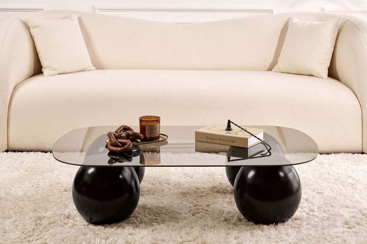 Deens ovale salontafel grijs getint glas zwarte bolpoten Evara 118x75 cm