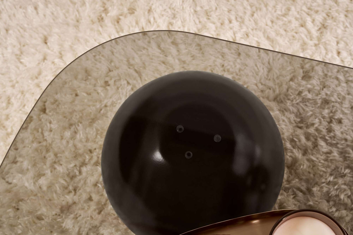 Deens ovale salontafel grijs getint glas zwarte bolpoten Evara 118x75 cm