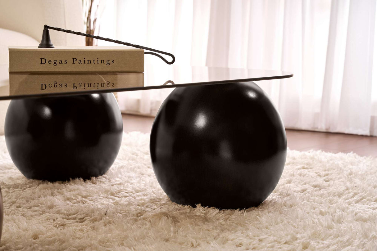 Deens ovale salontafel grijs getint glas zwarte bolpoten Evara 118x75 cm