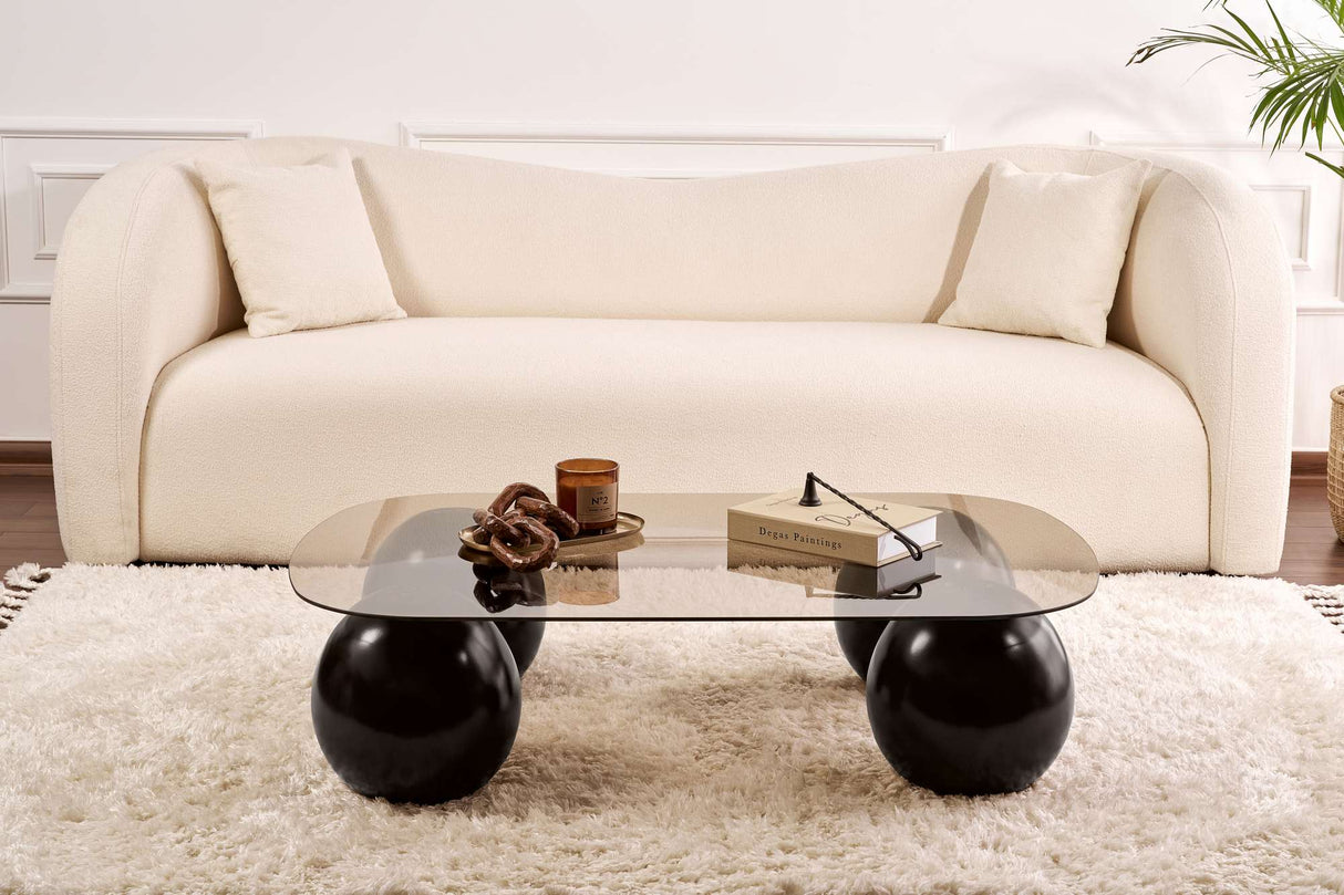 Deens ovale salontafel brons getint glas zwarte bolpoten Evara 118x75 cm